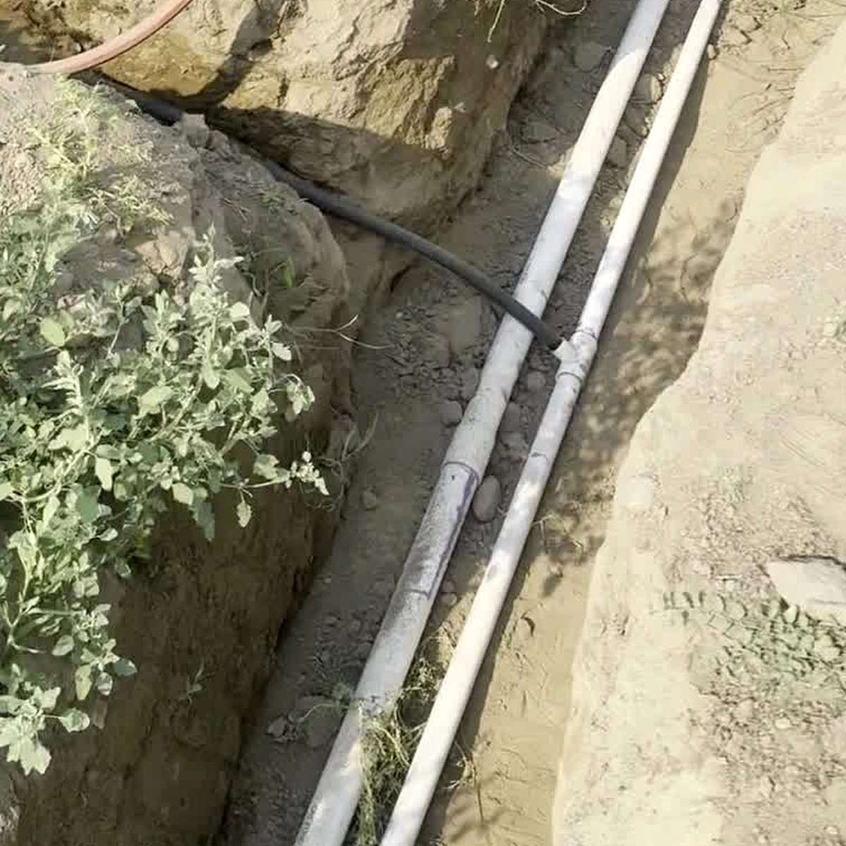Irrigation pipe in a dug ditch